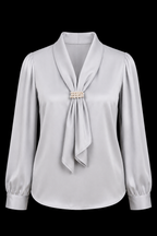 Light gray blouse with a decorative brooch on a black background