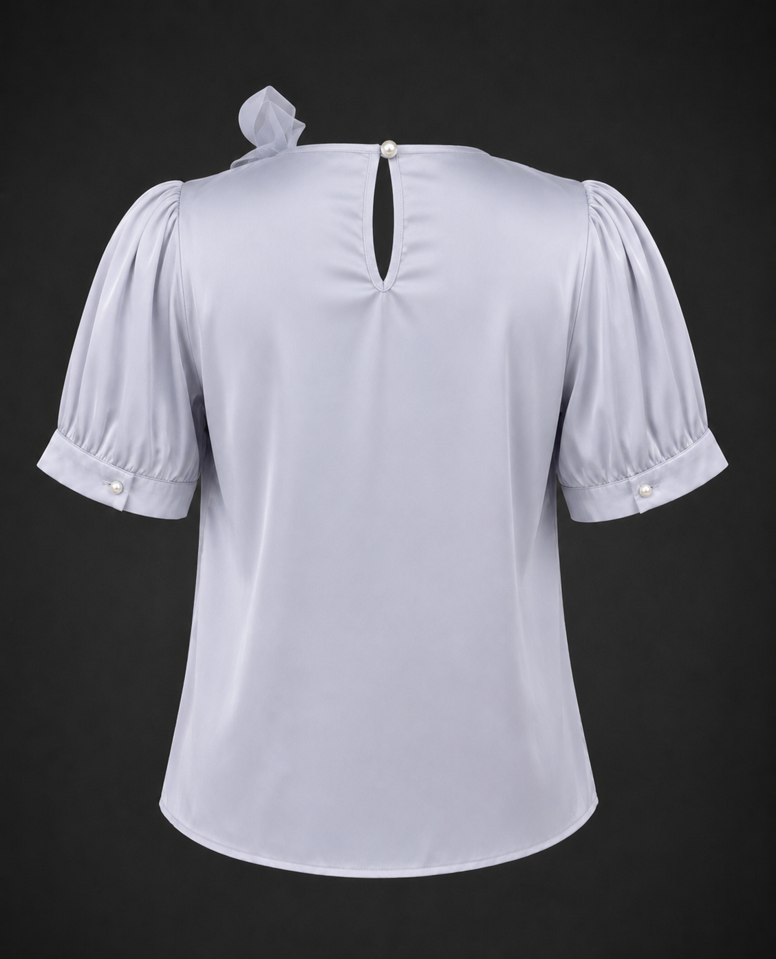 Light blue blouse with puff sleeves on a black background
