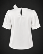 White blouse with puff sleeves on a black background