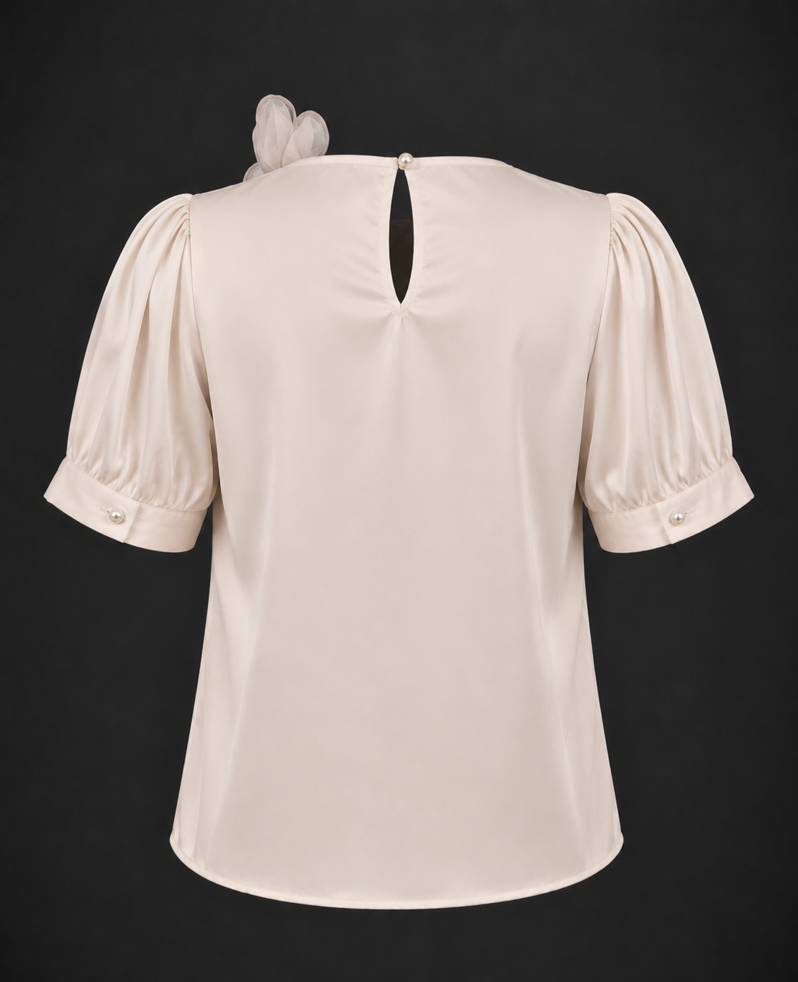 Beige blouse with puff sleeves on a black background