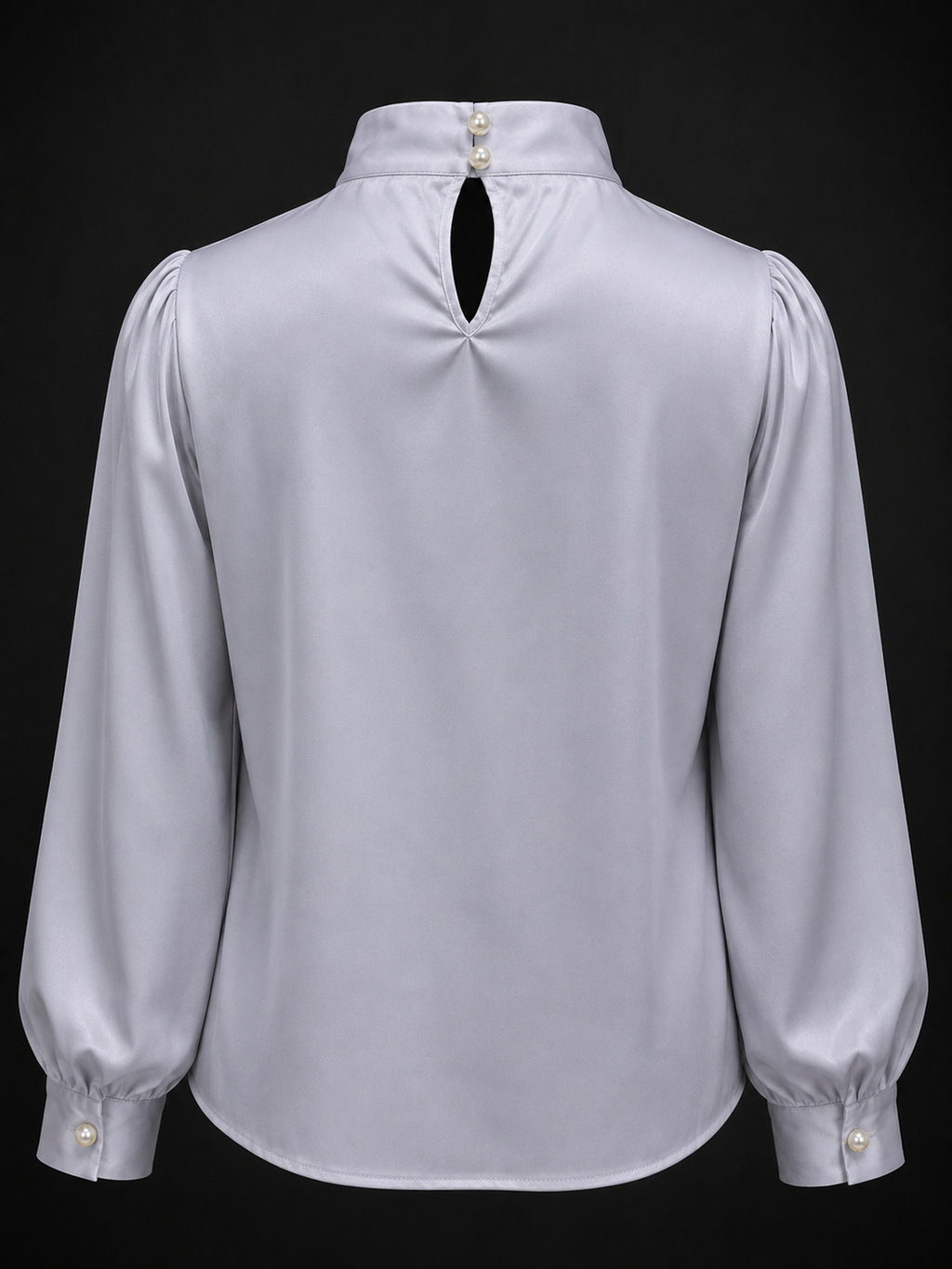 Light gray blouse with puffed sleeves on a black background