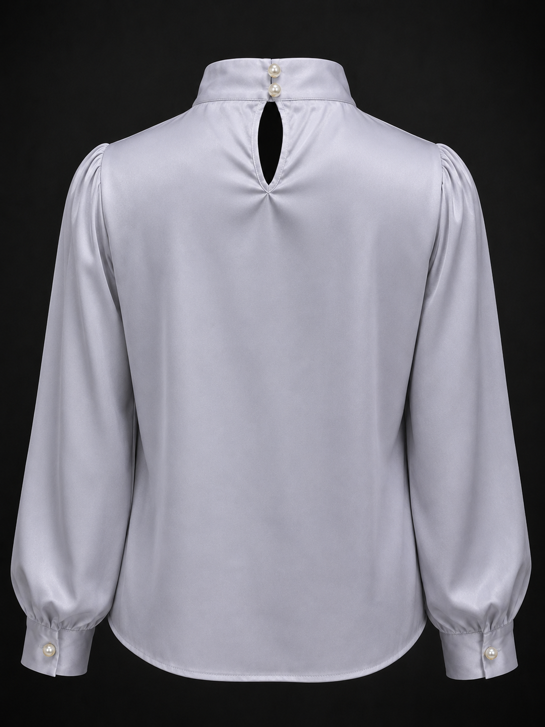 Light gray blouse with puffed sleeves on a black background