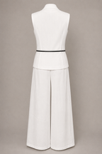 White sleeveless top and wide-leg pants on a mannequin against a beige background