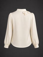 White blouse with long sleeves on a dark background
