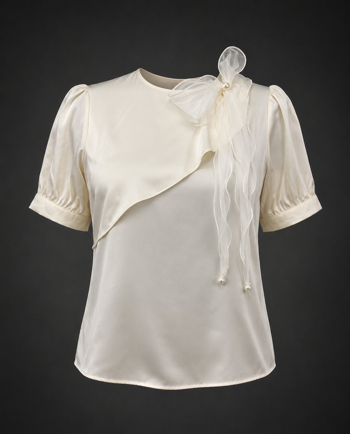 White blouse with sheer sleeves and a matching shrug on a dark background
