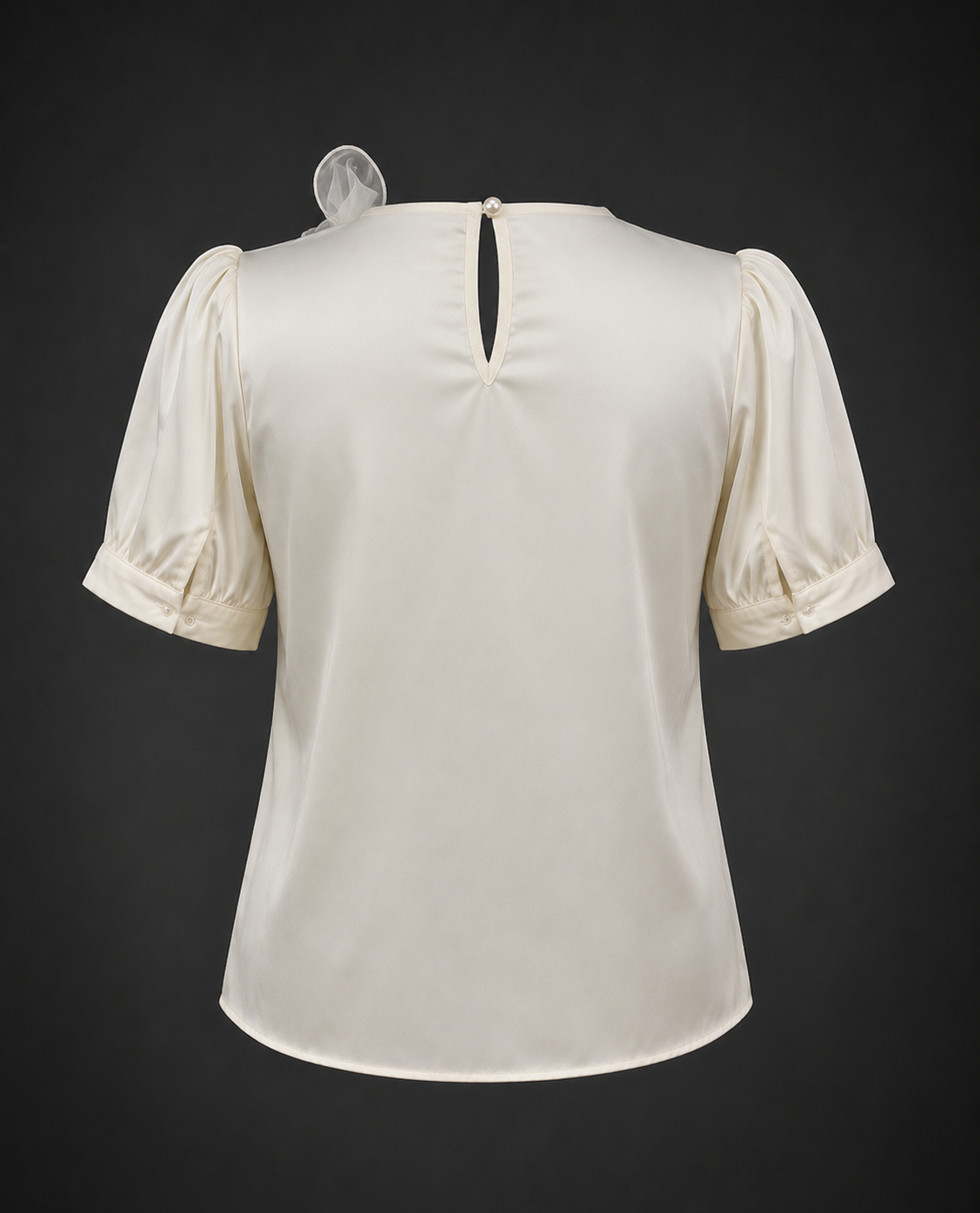 White blouse with puff sleeves on a dark background