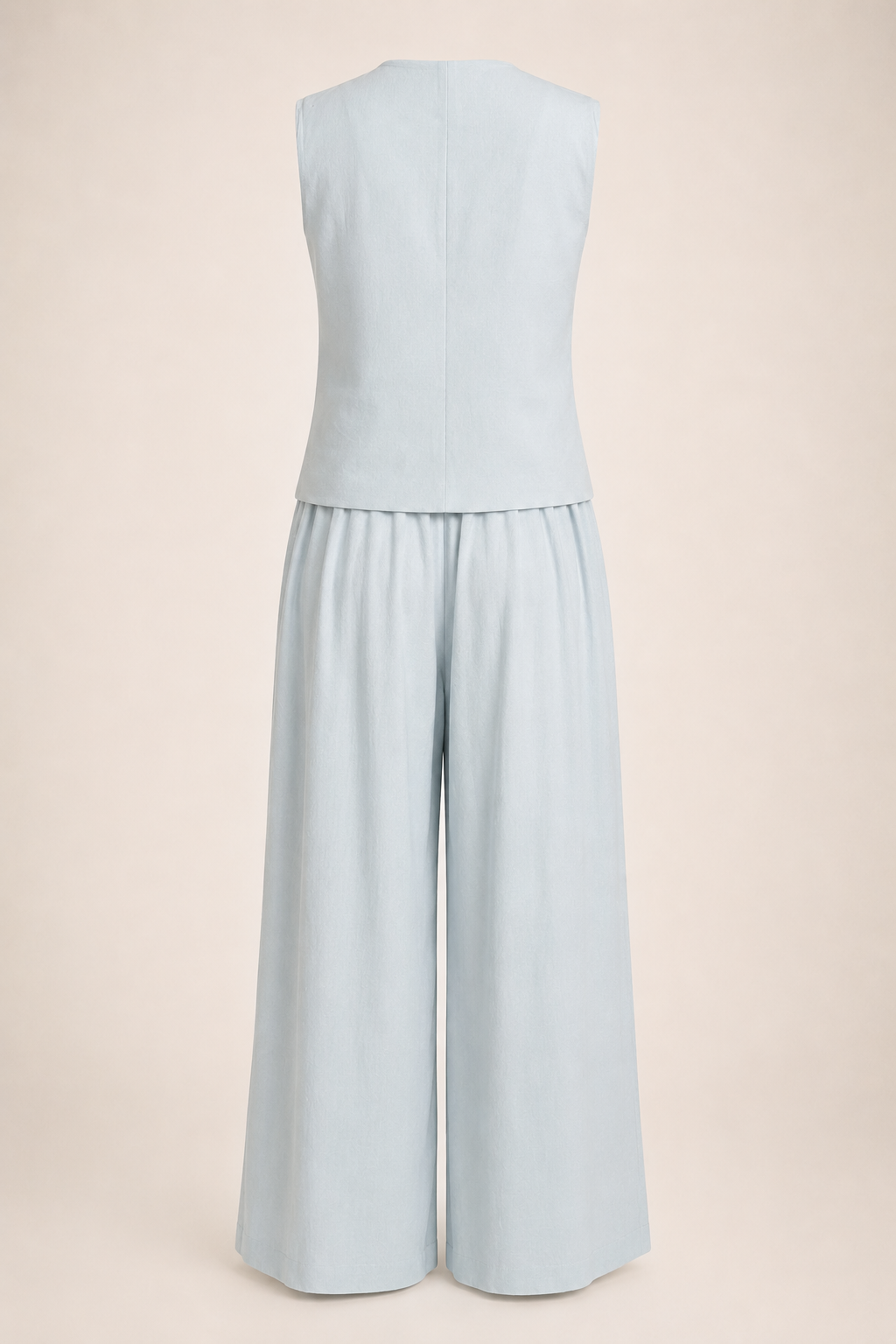Light blue sleeveless top and wide-leg pants set on a beige background