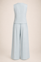 Light blue sleeveless top and wide-leg pants set on a beige background