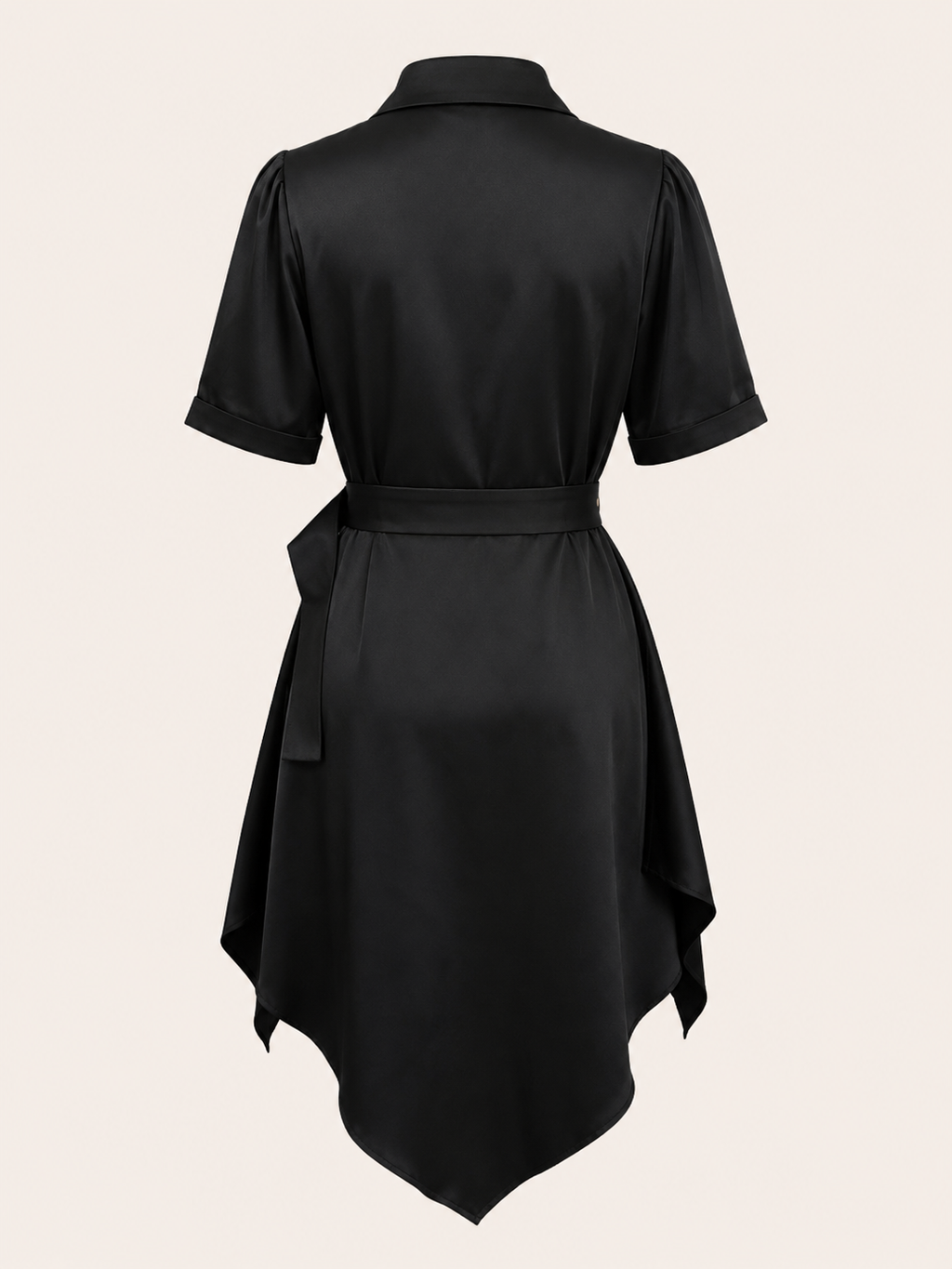 Black dress with a belt on a beige background