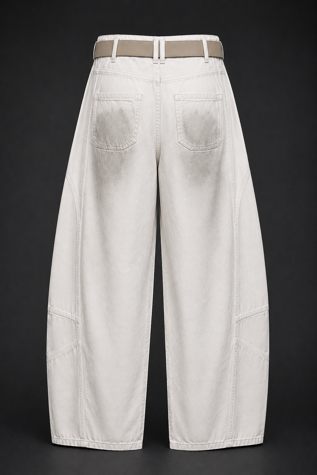 White wide-leg jeans with a belt on a black background