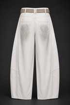 White wide-leg jeans with a belt on a black background