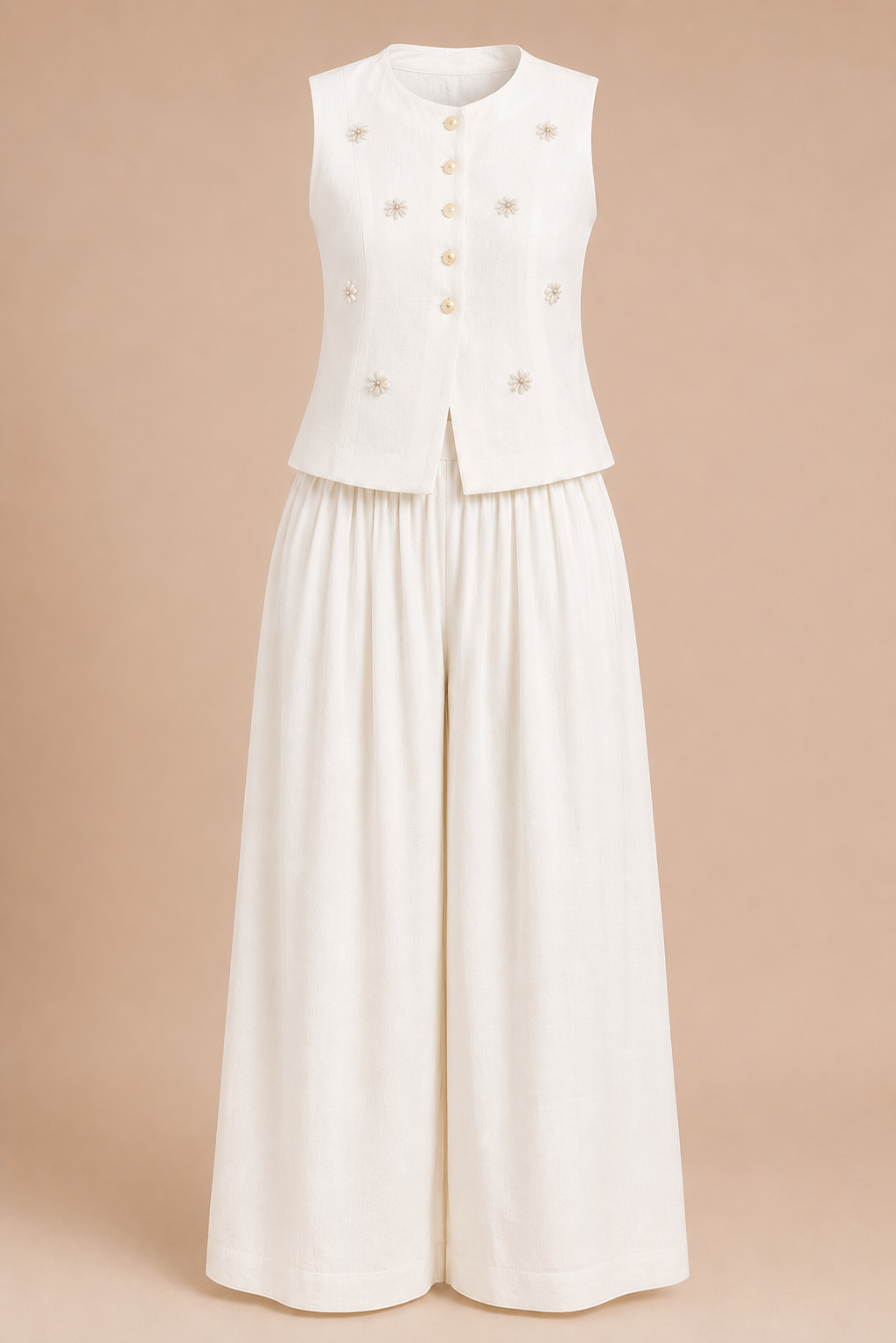 White sleeveless jacket with gold buttons and wide-leg pants on a beige background