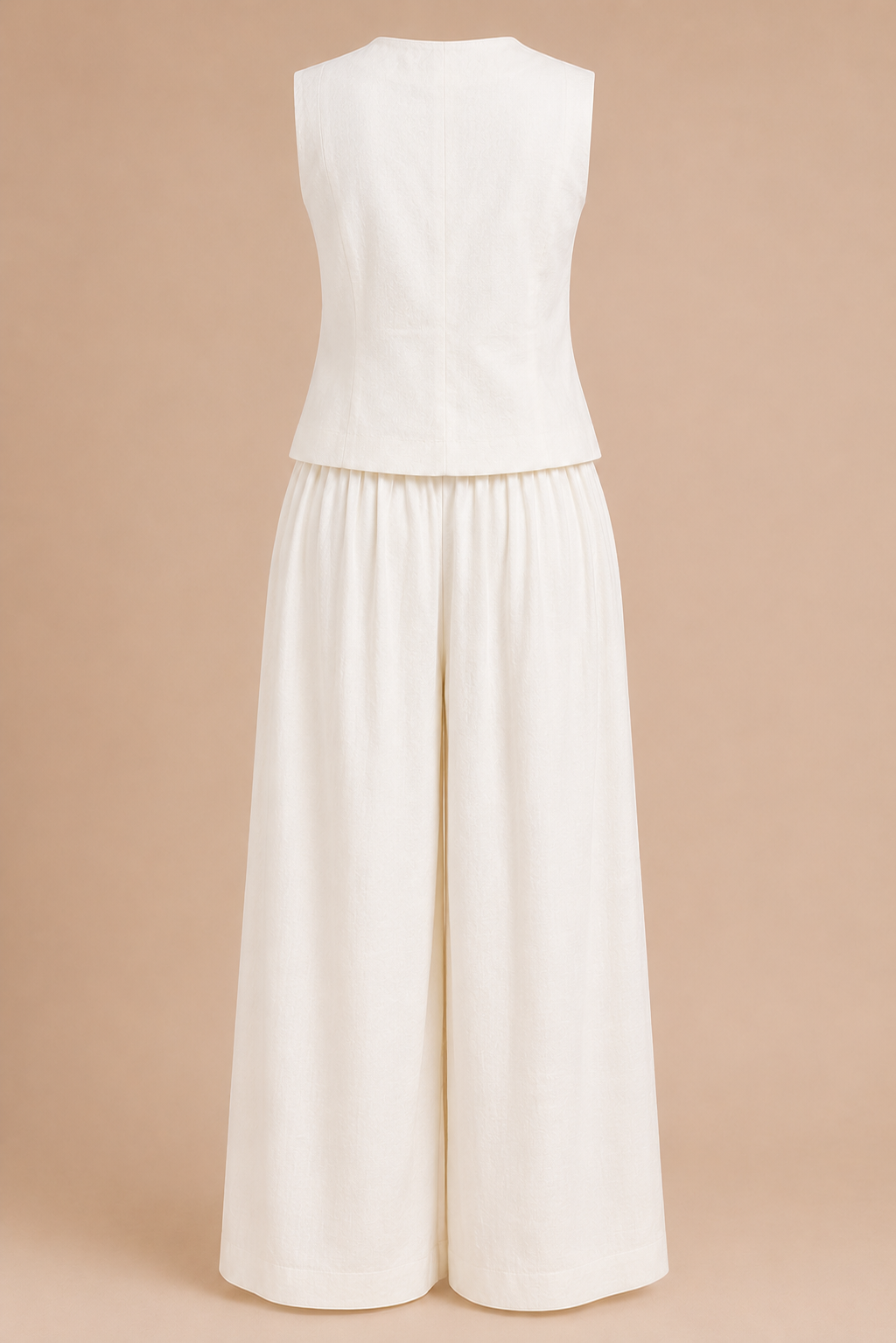 White sleeveless top and wide-leg pants set on a beige background