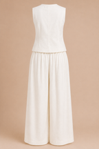 White sleeveless top and wide-leg pants set on a beige background