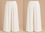 White wide-leg pants on a beige background