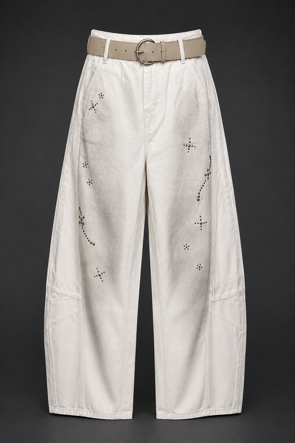 White pants with decorative elements on a black background