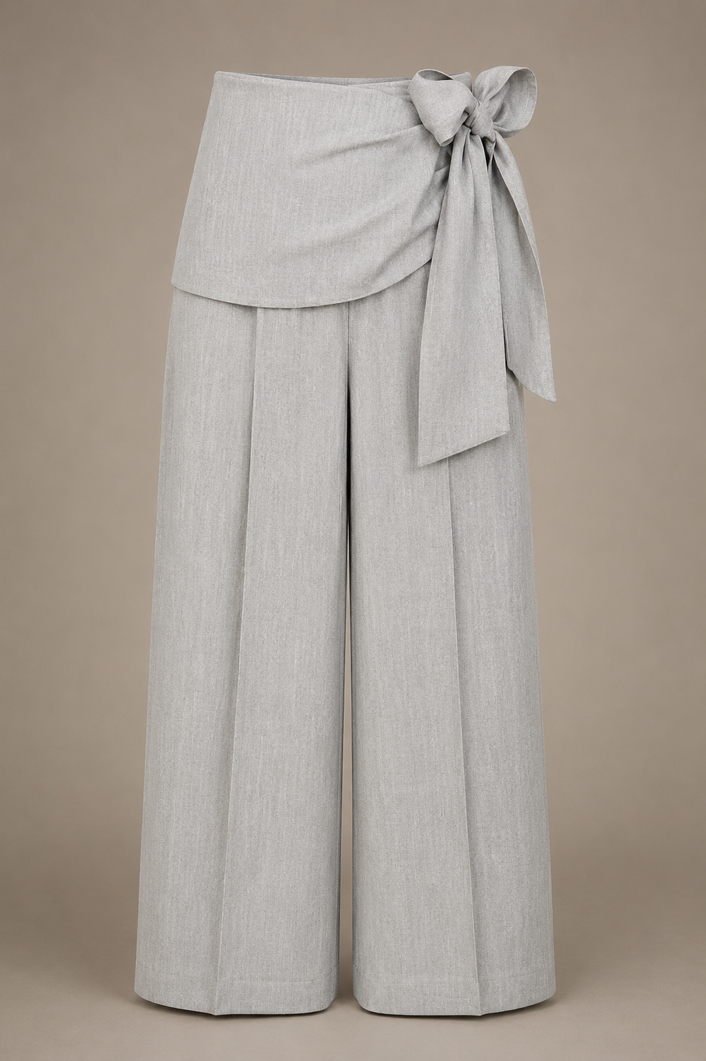 Light gray wide-leg pants with a tie waist on a beige background