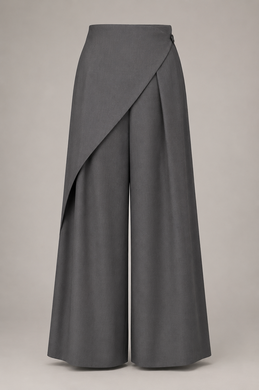 Gray wide-leg pants with a draped front panel on a beige background