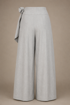 Light gray wide-leg pants with a tie waist on a beige background