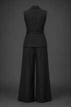 Black sleeveless top and wide-leg pants set on a gray background