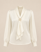 White blouse with a tie detail on a beige background