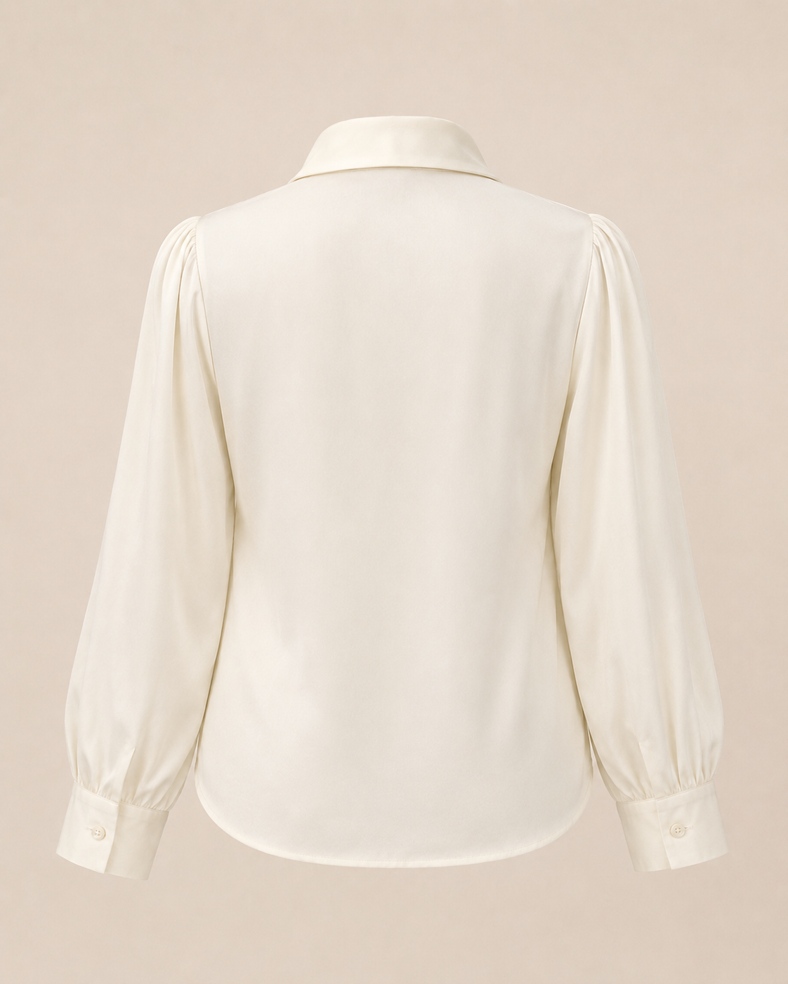White blouse with long sleeves on a beige background