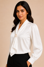 Woman wearing a white blouse with a beige background