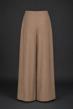 Beige wide-leg pants on a black background