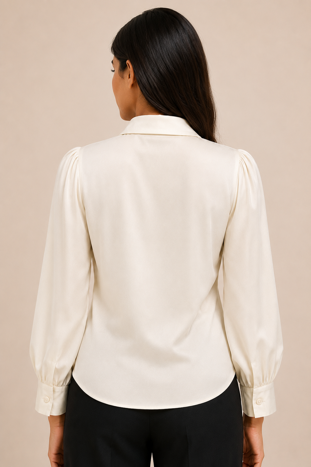 Woman wearing a cream blouse against a beige background