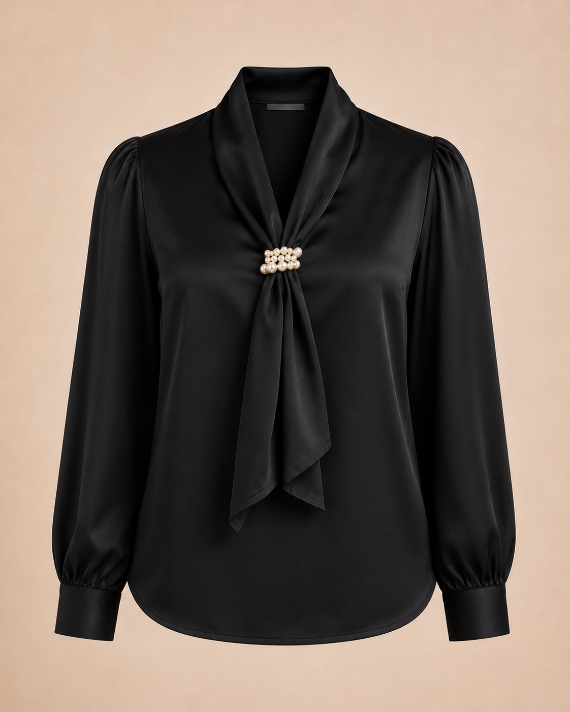 Black blouse with pearl detail on a beige background