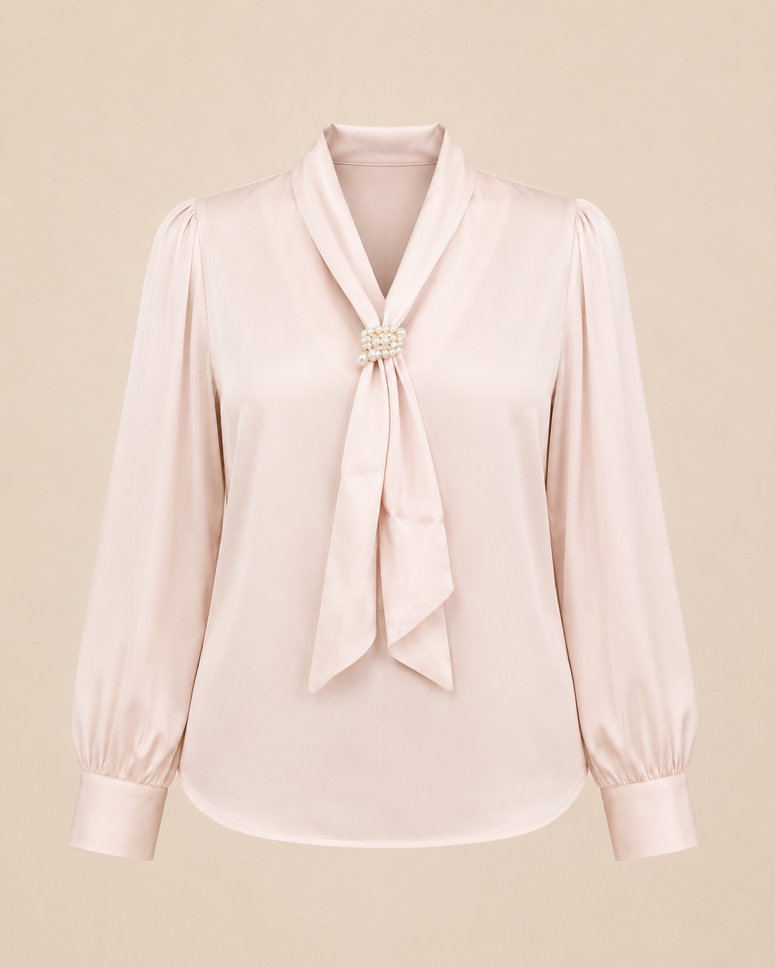 Light pink blouse with a tie detail on a beige background