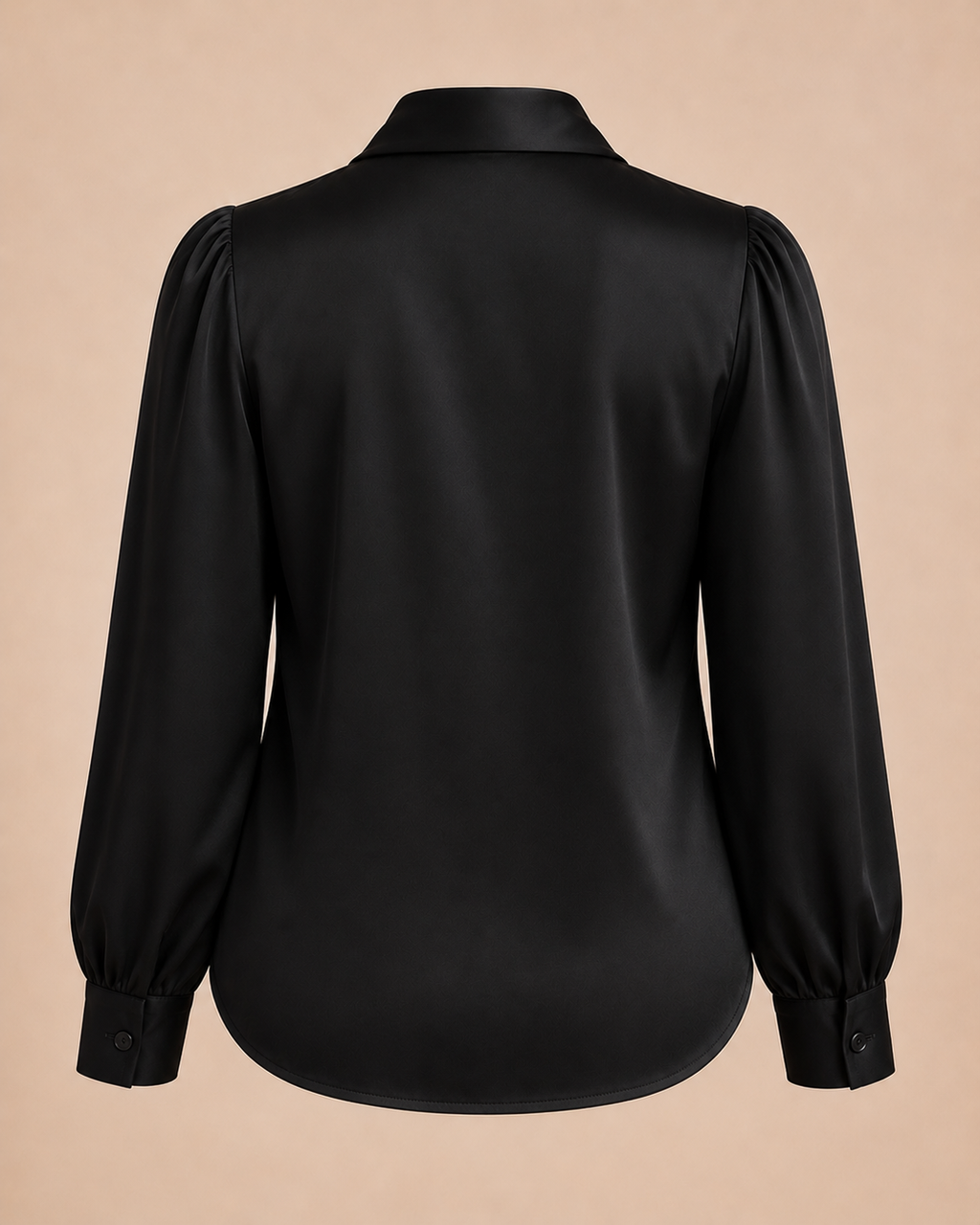Black blouse with puff sleeves on a beige background