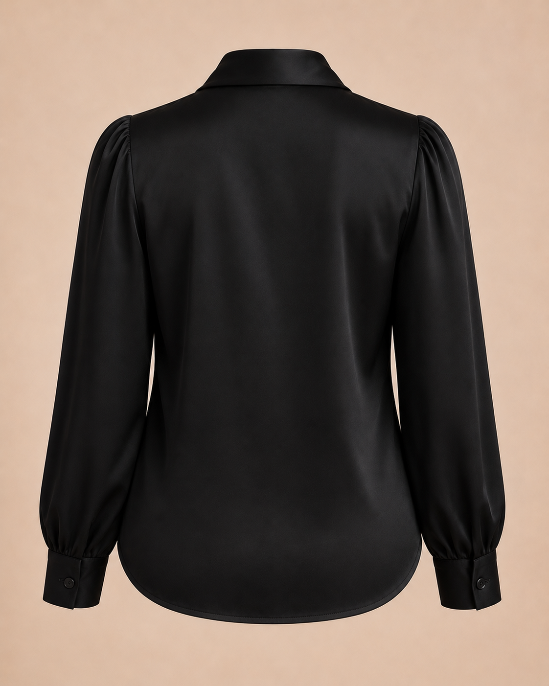 Black blouse with puff sleeves on a beige background