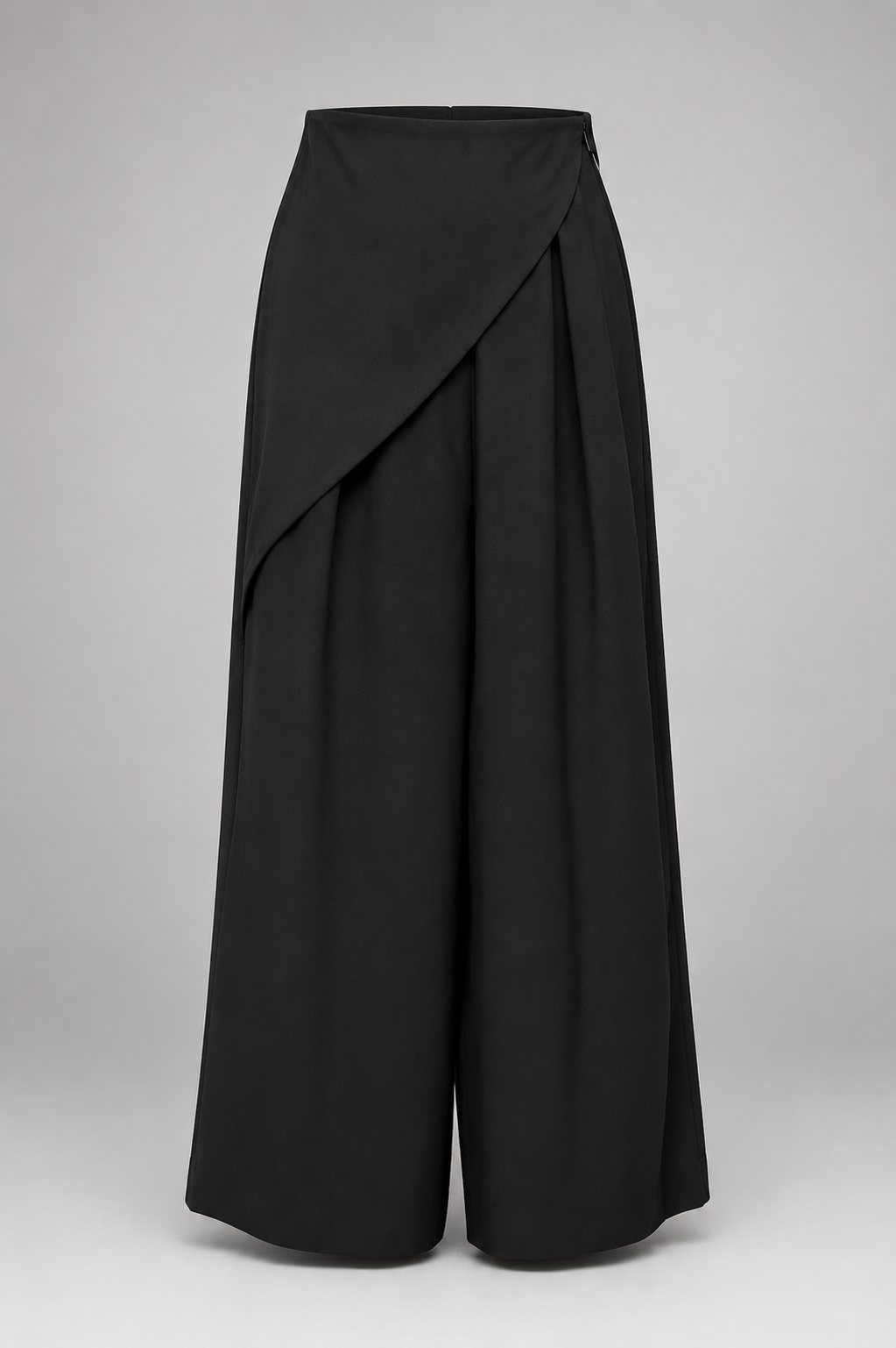 Black drape pants on a white background